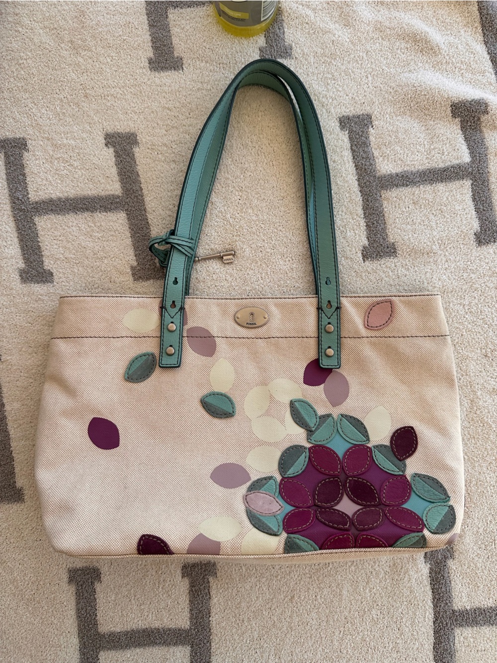 Fossil Cream Canvas Tote with Teal Handles and Purple Accents